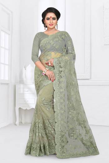 Here Is A Beautiful Heavy Designer Net Fabricated Saree And Blouse. This Saree And Blouse Are Beautified With Heavy Resham Embroidery All Over With Ceramic Stone Work. This Pretty Saree Comes With A Matching Satin Fabricated Inner. Buy This Heavy Designer Saree Now.