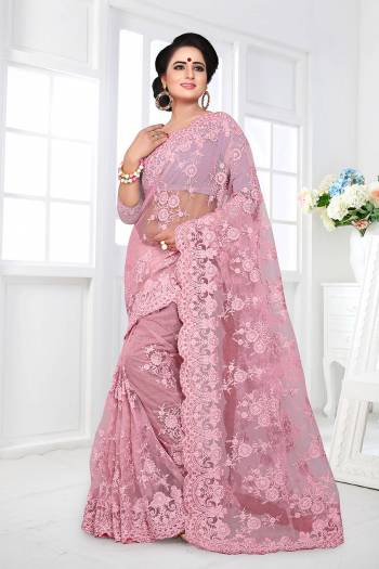 For A Rich, Heavy And Elegant Look, This Heavy Designer Saree Is Perfectly Suitable For All. This Saree And Blouse are Fabricated On Net Beautified With Heavy Resham Embroidery And Ceramic Stone Work. 