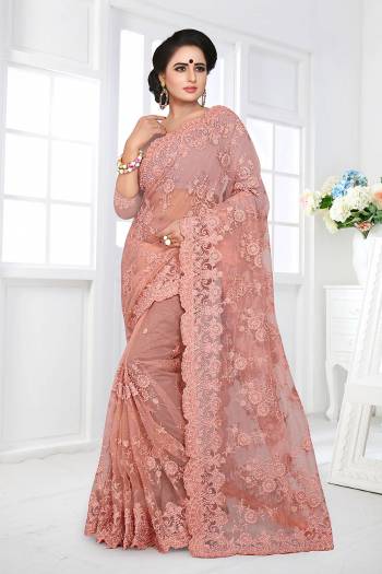 If You Are Fond Of Tone On Tone Embroidery, than This Designer Saree In Perfect For Your. This Heavy Saree And Blouse Are Fabricated On Net Beautified With Tone To Tone Heavy Resham Embroidery With Ceramic Stone Work All Over It. Buy This Saree Now.