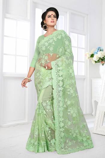 For A Rich, Heavy And Elegant Look, This Heavy Designer Saree Is Perfectly Suitable For All. This Saree And Blouse are Fabricated On Net Beautified With Heavy Resham Embroidery And Ceramic Stone Work. 