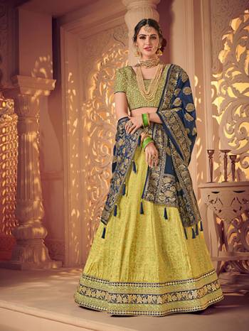 Bring out the best in you when wearing this Navy Blue and Light Greencolor jacquard fabrics and satin lehenga. Ideal for party, festive & social gatherings. this gorgeous lehenga featuring a beautiful mix of designs. Its attractive color and designer heavy embroidered lehenga with jacquard dupatta and fancy blouse, stone design, beautiful floral design work over the attire & contrast hemline adds to the look. Comes along with a contrast unstitched blouse.