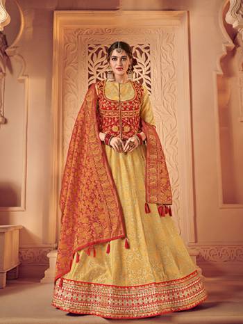 Look your ethnic best by wearing this red and gold color jacquard fabrics and satin lehenga. Ideal for party, festive & social gatherings. this gorgeous lehenga featuring a beautiful mix of designs. Its attractive color and designer heavy embroidered lehenga with jacquard dupatta and fancy blouse, stone design, beautiful floral design work over the attire & contrast hemline adds to the look. Comes along with a contrast unstitched blouse.