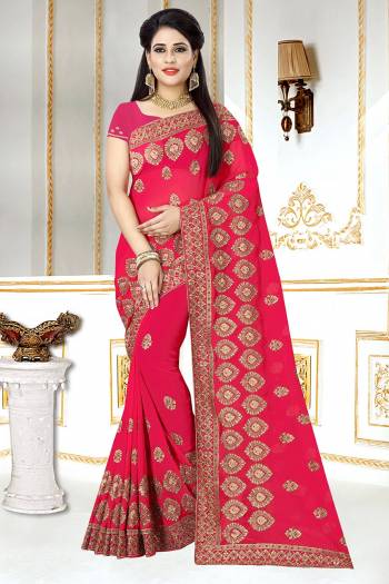 This Wedding And Festive Season, Look The Most Amazing Of All Wearing This Heavy Designer Saree In Rani Pink Color. This Saree And Blouse Are Georgette Based Beautified With Heavy Jari Embroidery And Stone Work.