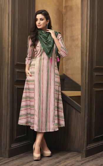 Look Pretty In this Readymade Kurti In Pink Color Paired With Contrasting Dark Green Colored Scarf. This Pretty Kurti Is Fabricated On Muslin Beautified With Lining Prints All Over Paired With Rayon Fabricated Embroidered Scarf.