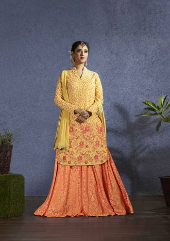 Celebrate This Festive Season With Some New Designer Pattern With This Designer Lehenga Suit In Yellow Colored Top And Dupatta Paired With Orange Colored Lehenga. Its Top Is Fabricated On Muslin Paired With Jacquard Silk Lehenga And Chiffon Dupatta. 