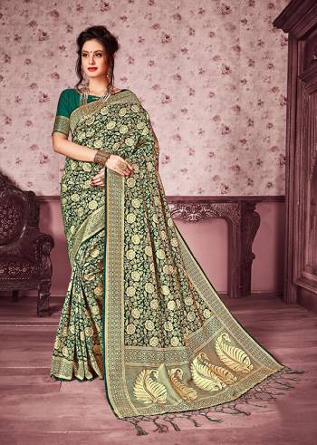 For a Bold And Beautiful Look, Grab This Heavy Woven Designer Silk Based Saree In Green And Gold Color Paired With Green Colored Blouse. This Saree Is Fabricated On Kanjivaram Art Silk Paired With Art Silk Fabricated Blouse. It Is Beautified With Heavy Weave All Over The Saree.