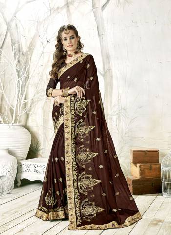 Enhance Your Personality Wearing This Heavy Designer Saree In Brown Color Paired With Brown Colored Blouse. This Saree Is Georgette Based With Heavy Embroidery Paired With Art Silk Fabricated Blouse. 