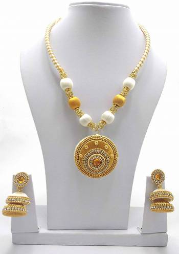 Give An Enhanced Look To Your Ethnic Attire Pairing It Up With This Attractive Necklace Set Made With Resham Threads And Beautified With Stone Work. Also It Comes With A Pretty Pair Of Earrings. This Set Can Be Paired With Same Or Contrasting Colored Attire. Buy This Now. 