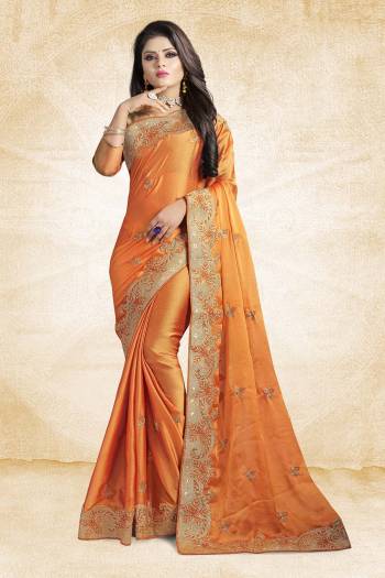 Get Ready For The Upcoming Festive And Wedding Season Wearing This Designer Saree In Orange Color Paired With Orange Colored Blouse. This Saree And Blouse Silk Based Beautified With Elegant Embroidered Lace Border. 