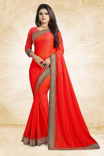 Here Is A Heavy And Elegant Looking Designer Saree In Orange Color Paired With Orange Colored Blouse. This Saree Is Fabricated On Satin Silk Paired With Art Silk Fabricated Blouse. It Has Heavy Embroidered Lace Border With Stone Work. Buy Now.