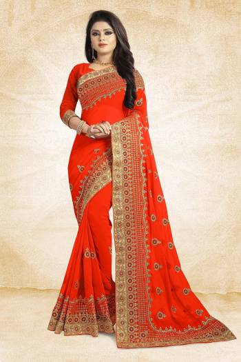 Celebrate This Festive Season With Beauty And Comfort Wearing This Heavy Designer Saree In Orange Color Paired With Orange Colored Blouse. This Saree Is Georgette Based With Heavy Embroidery Paired With Art Silk Fabricated Blouse. Buy Now.