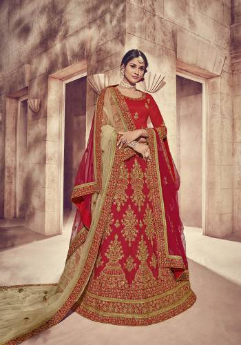 Here Is A Perfect Bridal Look For You With This Heavy designer Lehenga Choli In Red Color. This Lehenga Choli Is Silk Based Paired With Net Fabricated Dupatta Two Dupattas, One In Red And Another In Beige Color. Its Fabric Also Ensures Superb Comfort Throughout The Gala. 