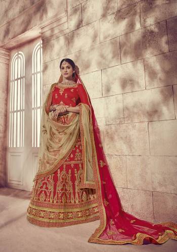 Get Ready For Your Big Day With This Heavy Designer Lehenga Choli In Red Color. This Heavy Embroidered Lehenga Choli Is Fabricated On Art Silk Paired With Net Fabricated Two Dupattas, One In Red And Another In Beige Color. It Is Beautified With Heavy Jari Embroidery and Stone Work. Buy Now