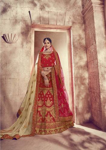 Here Is A Perfect Bridal Look For You With This Heavy designer Lehenga Choli In Red Color. This Lehenga Choli Is Silk Based Paired With Net Fabricated Dupatta Two Dupattas, One In Red And Another In Beige Color. Its Fabric Also Ensures Superb Comfort Throughout The Gala. 