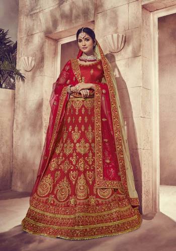 Get Ready For Your Big Day With This Heavy Designer Lehenga Choli In Red Color. This Heavy Embroidered Lehenga Choli Is Fabricated On Art Silk Paired With Net Fabricated Two Dupattas, One In Red And Another In Beige Color. It Is Beautified With Heavy Jari Embroidery and Stone Work. Buy Now