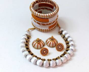 Grab This Beautiful Set Of Necklace Which Comes With A very Pretty Pair Of Earrings And Bangles Set. This Pretty set Is Made With Resham Thread Beautified With Stone Work. It Can Be Paired With Any Same Or Contrasting Colored Ethnic Attire. 