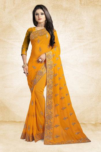 For A Heavy And Elegant Look, This Saree Is Perfect For Your Choice. Grab This Deisgner Saree In Musturd Yellow Color Paired With Musturd Yellow Colored Blouse. This Saree Is Fabricated On Georgette Beautified With Heavy Embroidery Paired With Art Silk Fabricated Blouse. 