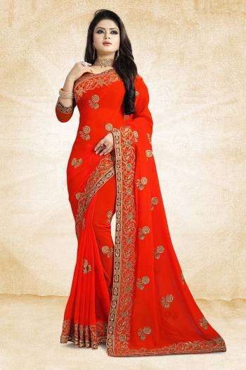 Add This Beautiful Designer Saree To Your Wardrobe In Orange Color Paired With Orange Colored Blouse. This Pretty Embroidered Saree Is Georgette Based Paired With Art Silk Fabricated Blouse. It Is Light Weight and Easy To Drape. Buy Now.