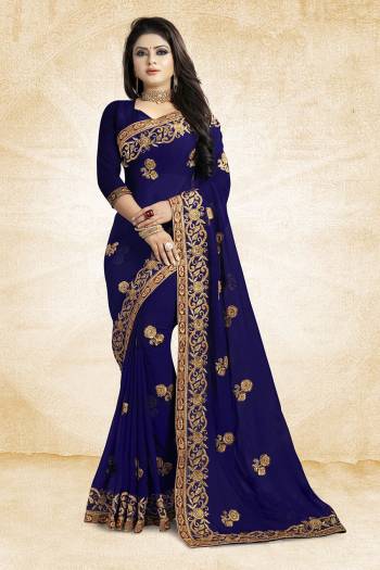 Add This Beautiful Designer Saree To Your Wardrobe In Navy Blue Color Paired With Navy Blue Colored Blouse. This Pretty Embroidered Saree Is Georgette Based Paired With Art Silk Fabricated Blouse. It Is Light Weight and Easy To Drape. Buy Now.