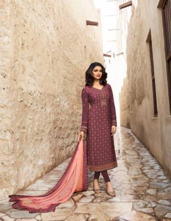 A Must Have Shade In Every Womens Wardrobe Is Here With This Designer Straight Suit In Wine Color Paired With Contrasting Peach Colored Dupatta. Its Top And bottom Are Fabricated on Crepe Paired With Chiffon Fabricated Dupatta. Buy This Suit Now.