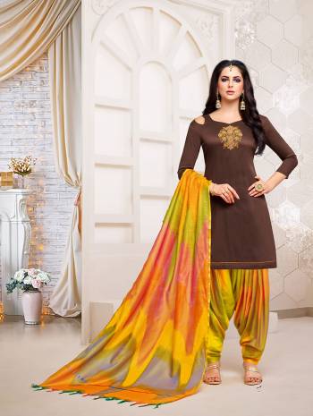 Stylist in every sense, this Brown colored patiala suit with beautiful  handwork. Crafted from soft silk with banarasi dupatta fabric, it is light in weight and will be soft against your skin, this suit set will go well with sandal sand look fashionable.