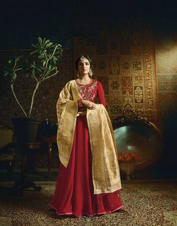 Adorn The Pretty Angelic Look Wearing This Designer Floor Length Suit In Red Color Paired With Cream Colored Dupatta. Its Top Is Fabricated On Satin Georgette Paired With Santoon Bottom And Banarasi Jacquard Silk Dupatta. Its Royal Color Combination Will Give And Eye Catchy Look.