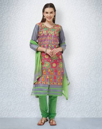 Grab This Designer Straight Suit For Your Casuals In Grey And Green Color. This Dress Material Is Fabricated On Cotton Paired With Chiffon Dupatta. It Is Beautified With Contrasting Thread Work all over The Top. Buy Now.