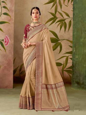 Enfold yourself in the divinity of the beige-red silk saree. Add jewelry with antique touch  for a unique look. 