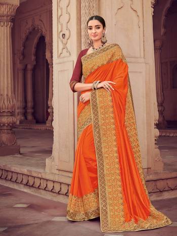 Classy, sensuous and versatile are the perfect words to describe this orange color silk fabric saree. Ideal for party, festive & social gatherings. this gorgeous saree featuring a beautiful mix of designs. Its attractive color and designer heavy embroidered design, stone design work, beautiful floral design all over in saree work over the attire & contrast hemline adds to the look. Comes along with a contrast unstitched blouse.