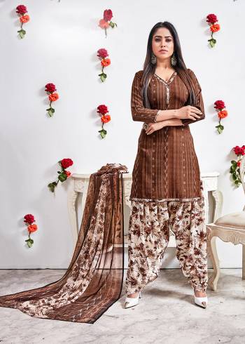 This Pretty crepe fabricated floral printed patiala style suit comes with Crepe fabricated bottom with chiffon  printed dupatta. Get This Dress Material Stitched As Per your Desired Fit And Comfort. Pair it with high heels and look effortlessly chic and fashionable.