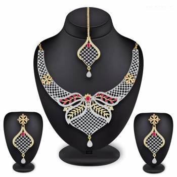 Grab This Heavy Necklace Set For The Upcoming Wedding Season In Golden And Silver Color Beautified With Diamond Work All Over. It Comes With A Pair Of Earrings And A Maang Tika. You Can Pair This Up With Any Colored Heavy Traditional Attire. 