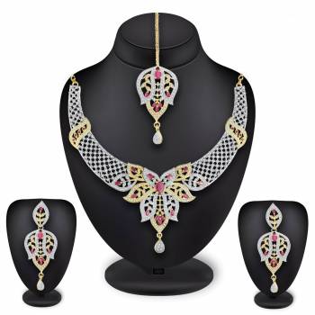 Grab This Heavy Necklace Set For The Upcoming Wedding Season In Golden And Silver Color Beautified With Diamond Work All Over. It Comes With A Pair Of Earrings And A Maang Tika. You Can Pair This Up With Any Colored Heavy Traditional Attire. 