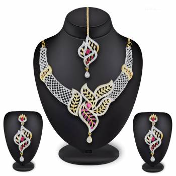 Grab This Heavy Necklace Set For The Upcoming Wedding Season In Golden And Silver Color Beautified With Diamond Work All Over. It Comes With A Pair Of Earrings And A Maang Tika. You Can Pair This Up With Any Colored Heavy Traditional Attire. 