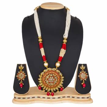 For A Queen Look, Here Is A Designer Royal Looking Necklace Set In Golden Color. This Necklace Set Can Be Paired With Heavy Ethnic Attire For More Enhanced Look. Buy Now