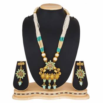 For A Queen Look, Here Is A Designer Royal Looking Necklace Set In Golden Color. This Necklace Set Can Be Paired With Heavy Ethnic Attire For More Enhanced Look. Buy Now