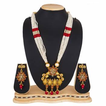 For A Queen Look, Here Is A Designer Royal Looking Necklace Set In Golden Color. This Necklace Set Can Be Paired With Heavy Ethnic Attire For More Enhanced Look. Buy Now