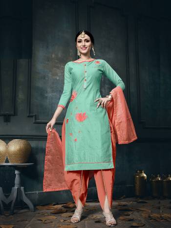 Another Designer Suit Is Here In Sea Green Colored Top Paired With Contrasting Orange Colored Bottom And Dupatta. This Dress Material Is Cotton Based Paired With Soft Silk Fabricated Dupatta. 