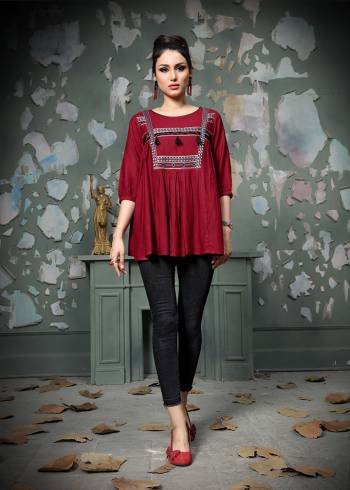 Add This Pretty Designer Readymade Top To your Wardrobe In Maroon Color.This Pretty Cotton Based Top Is Beautified With Multi Colored Thread Work And Avialable In All Regular Sizes. 