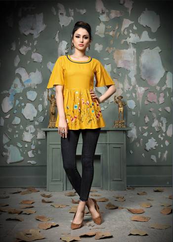 Add This Pretty Designer Readymade Top To your Wardrobe In Yellow Color.This Pretty Cotton Based Top Is Beautified With Multi Colored Thread Work And Avialable In All Regular Sizes. 