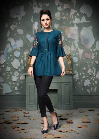 Add This Pretty Designer Readymade Top To your Wardrobe In Blue Color.This Pretty Cotton Based Top Is Beautified With Multi Colored Thread Work And Avialable In All Regular Sizes. 