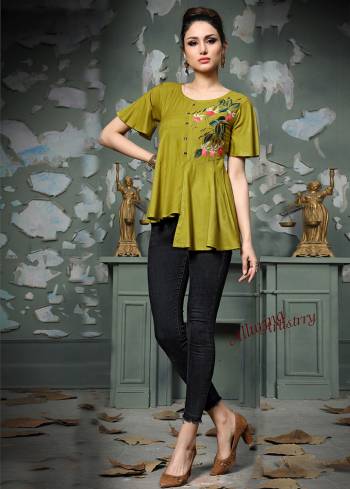 Add This Pretty Designer Readymade Top To your Wardrobe In Pear Green Color.This Pretty Cotton Based Top Is Beautified With Multi Colored Thread Work And Avialable In All Regular Sizes. 