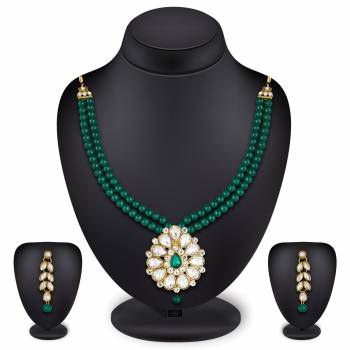 Grab This Very Pretty Pearl Necklace Set In Green Color Beautified With Stone Work. You Can Pair This Up With Same Or Any Contrasting Colored Traditional Attire. Buy Now.