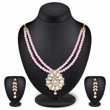 Grab This Very Pretty Pearl Necklace Set In Pink Color Beautified With Stone Work. You Can Pair This Up With Same Or Any Contrasting Colored Traditional Attire. Buy Now.