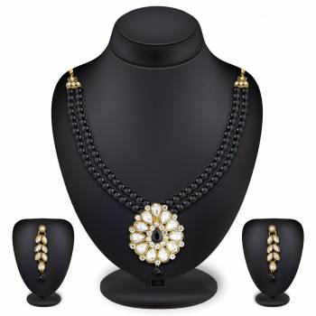 Grab This Very Pretty Pearl Necklace Set In Black Color Beautified With Stone Work. You Can Pair This Up With Same Or Any Contrasting Colored Traditional Attire. Buy Now.