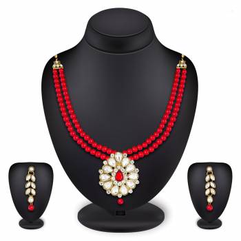 Grab This Very Pretty Pearl Necklace Set In Red Color Beautified With Stone Work. You Can Pair This Up With Same Or Any Contrasting Colored Traditional Attire. Buy Now.