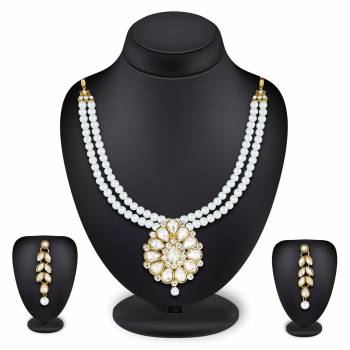 Grab This Very Pretty Pearl Necklace Set In White Color Beautified With Stone Work. You Can Pair This Up With Same Or Any Contrasting Colored Traditional Attire. Buy Now.