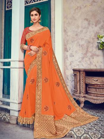 Presenting this orange color two tone silk fabrics saree. Ideal for party, festive & social gatherings. this gorgeous saree featuring a beautiful mix of designs. Its attractive color and heavy designer embroidered and silk saree, beautiful floral design all over work over the attire & contrast hemline adds to the look. Comes along with a contrast unstitched blouse.