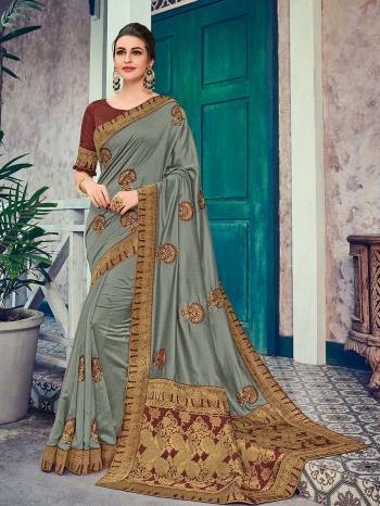 The fabulous pattern makes this saree a classy number to be included in your wardrobe. grey color two tone silk fabrics saree. Ideal for party, festive & social gatherings. this gorgeous saree featuring a beautiful mix of designs. Its attractive color and heavy designer embroidered and silk saree, beautiful floral design all over work over the attire & contrast hemline adds to the look. Comes along with a contrast unstitched blouse.