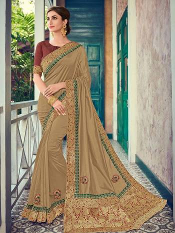 Presenting this beige color two tone silk fabrics saree. Ideal for party, festive & social gatherings. this gorgeous saree featuring a beautiful mix of designs. Its attractive color and heavy designer embroidered and silk saree, beautiful floral design all over work over the attire & contrast hemline adds to the look. Comes along with a contrast unstitched blouse.