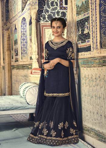 Enhance Your Personality In This Beautiful Designer Sharara Suit Availabe For You And Your Daughter In Navy Blue Color. Its Top Is Fabricated On Satin Georgette Paired With Net Fabricated Bottom And Dupatta. This Suit Also Ensures Superb Comfort And Easy To Carry Throughout The Gala.